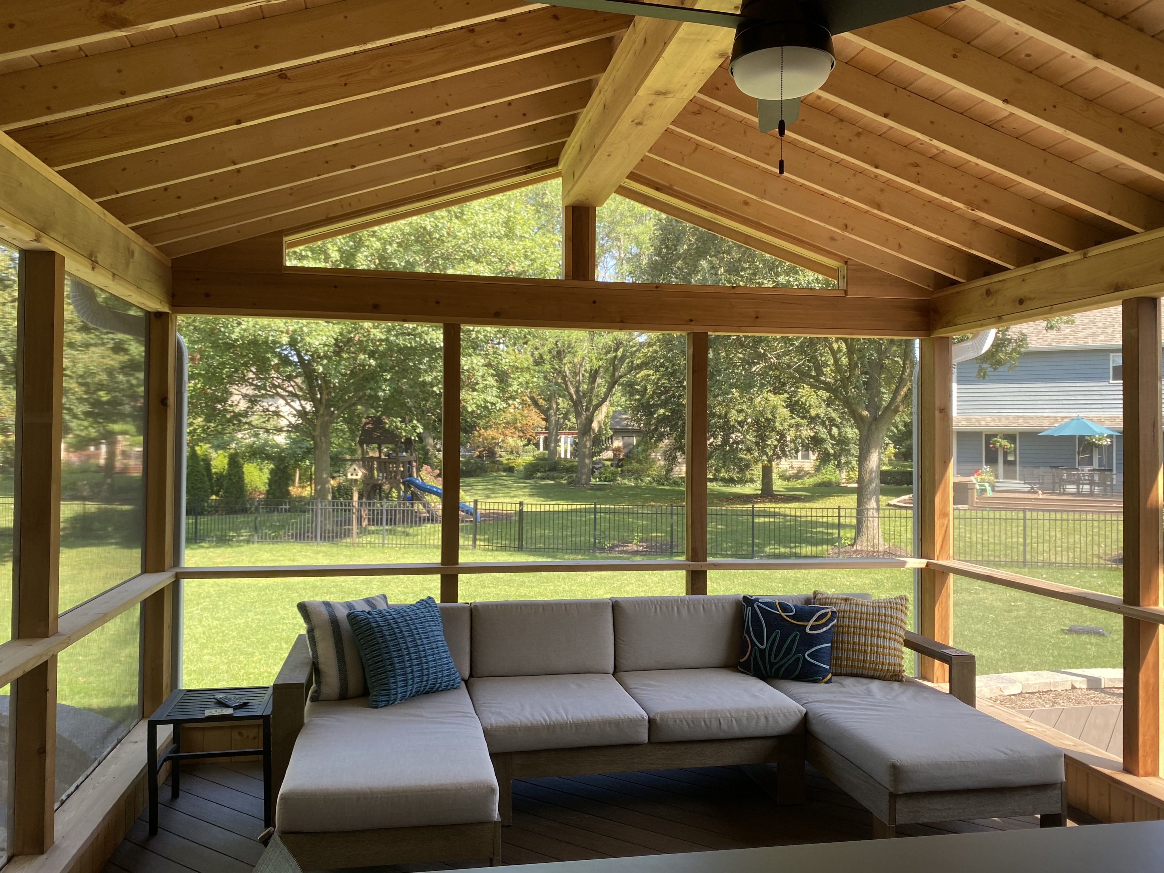 Inside a screened porch overlooking a Naperville backyard.